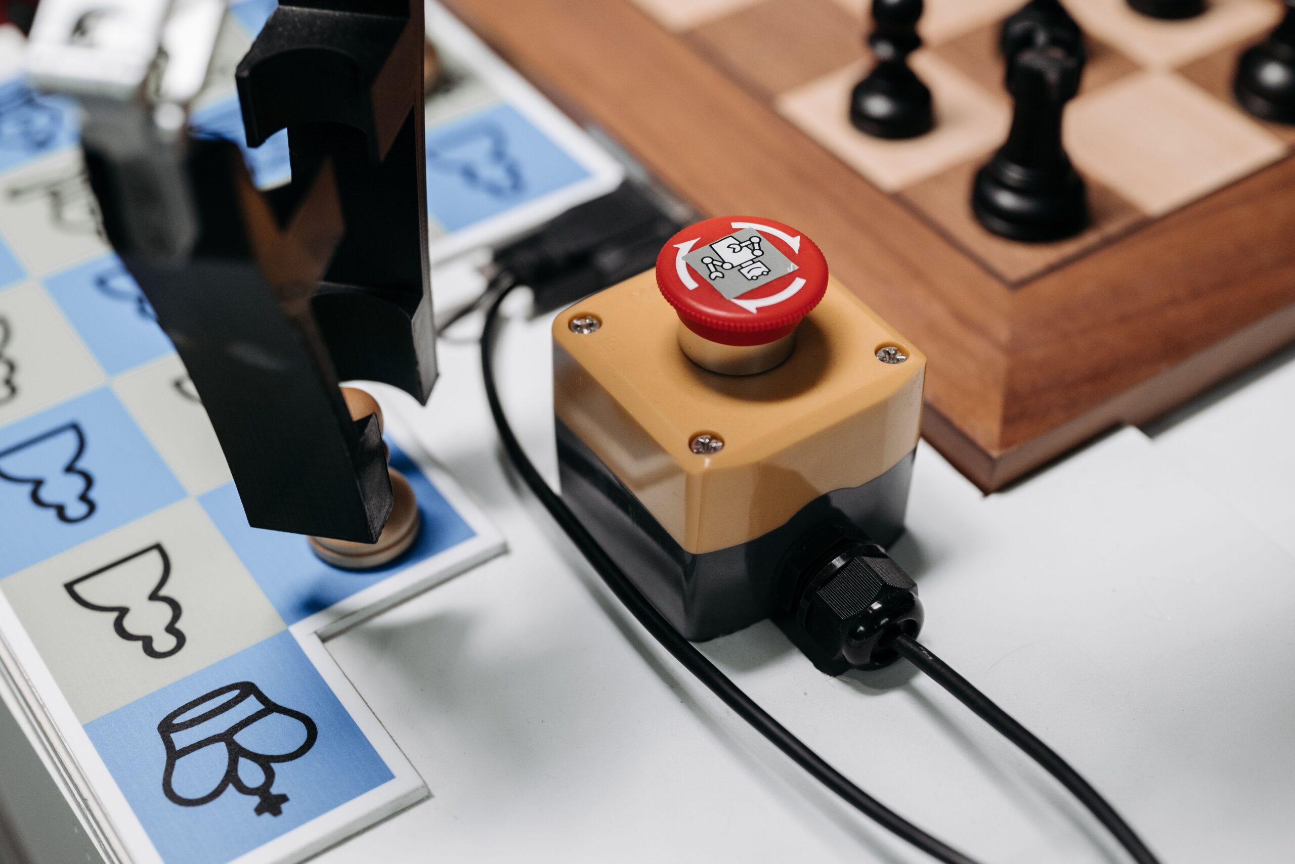 Robotic arm making a decision on a chessboard, representing autonomous AI agent decisions