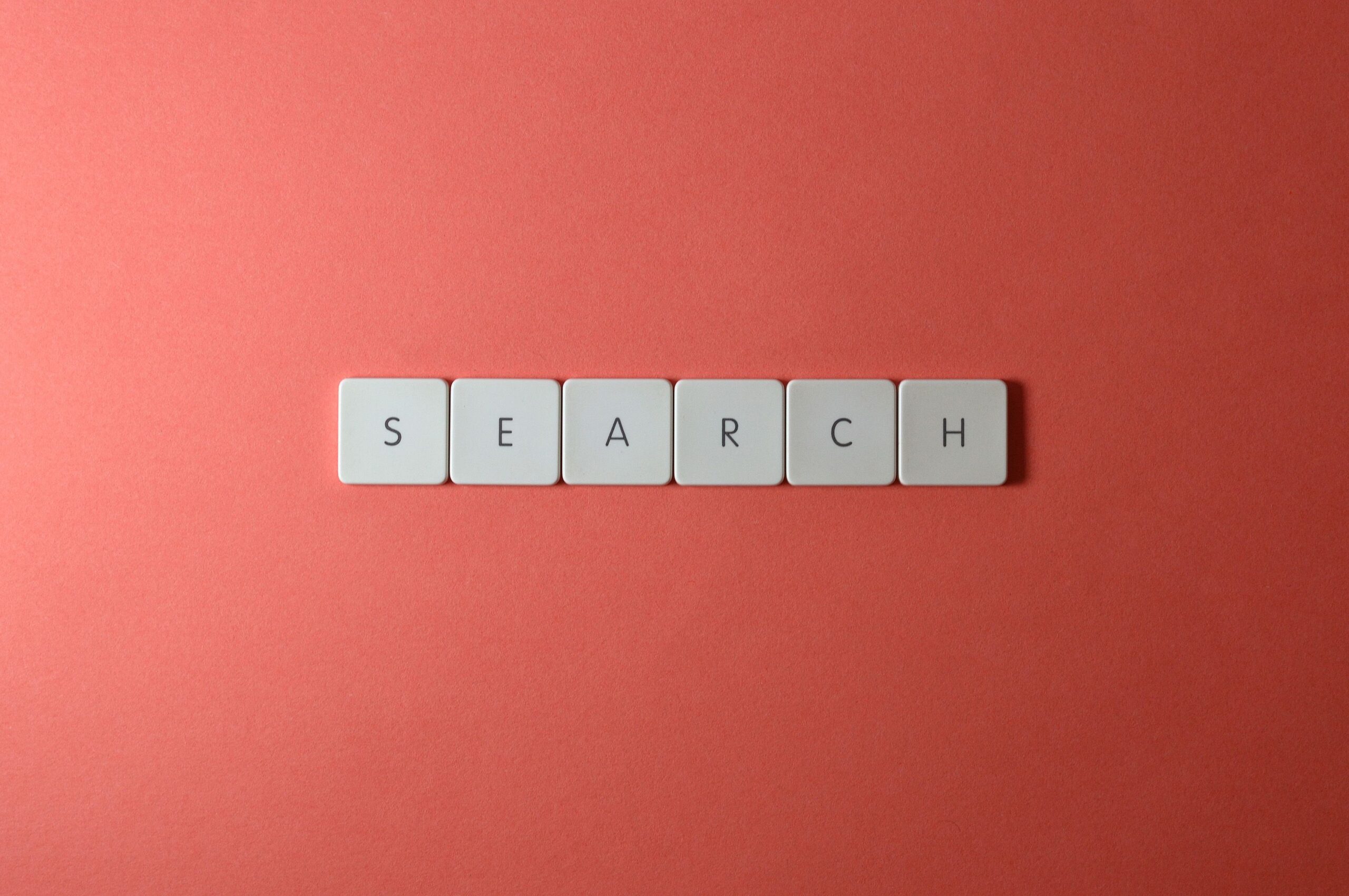 Keyboard key spelling SEARCH, representing AI-driven search visibility