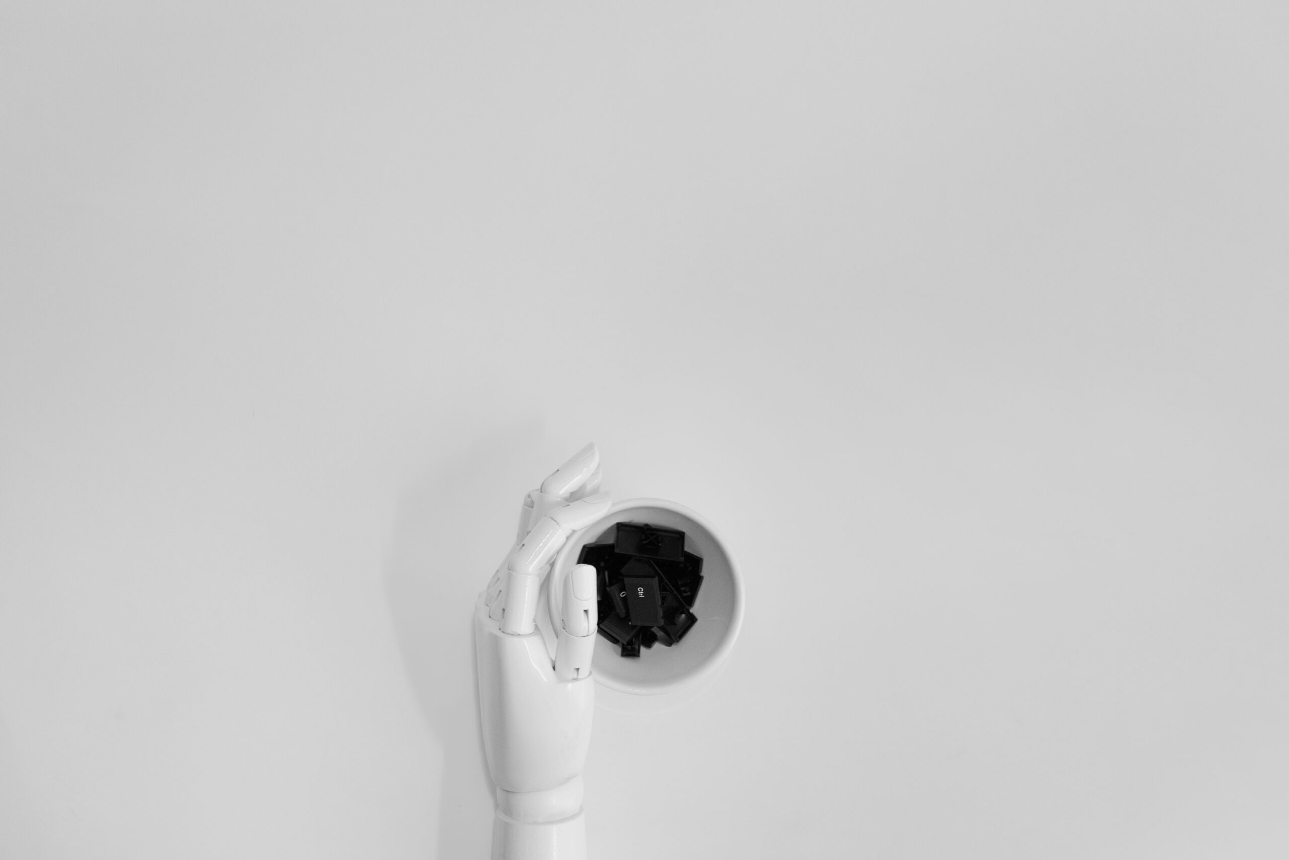 Robotic hand on a keyboard, representing AI-generated SEO content