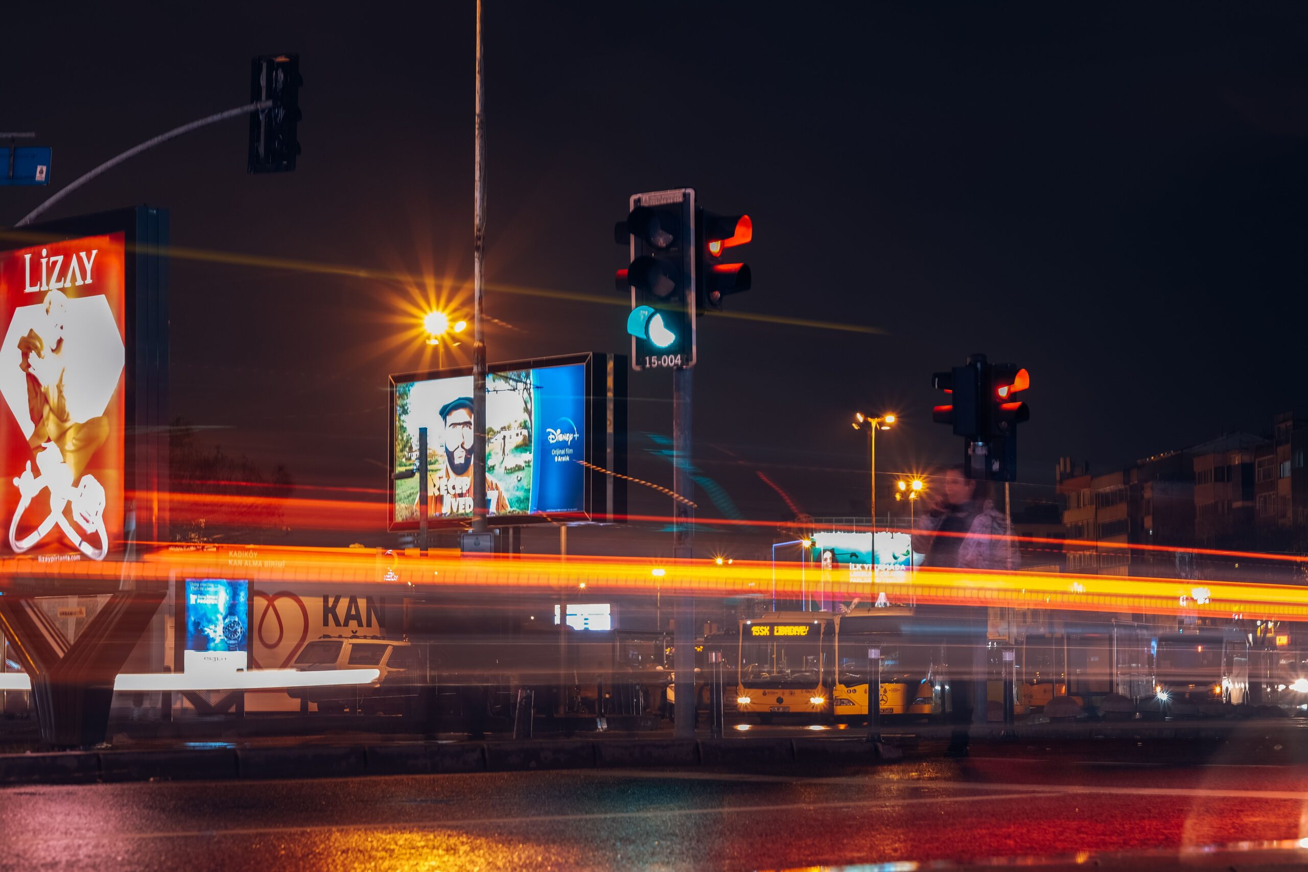 City street at night with light trails, representing brand invisibility in AI