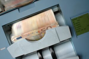 Banknote counting machine representing automated financial processes