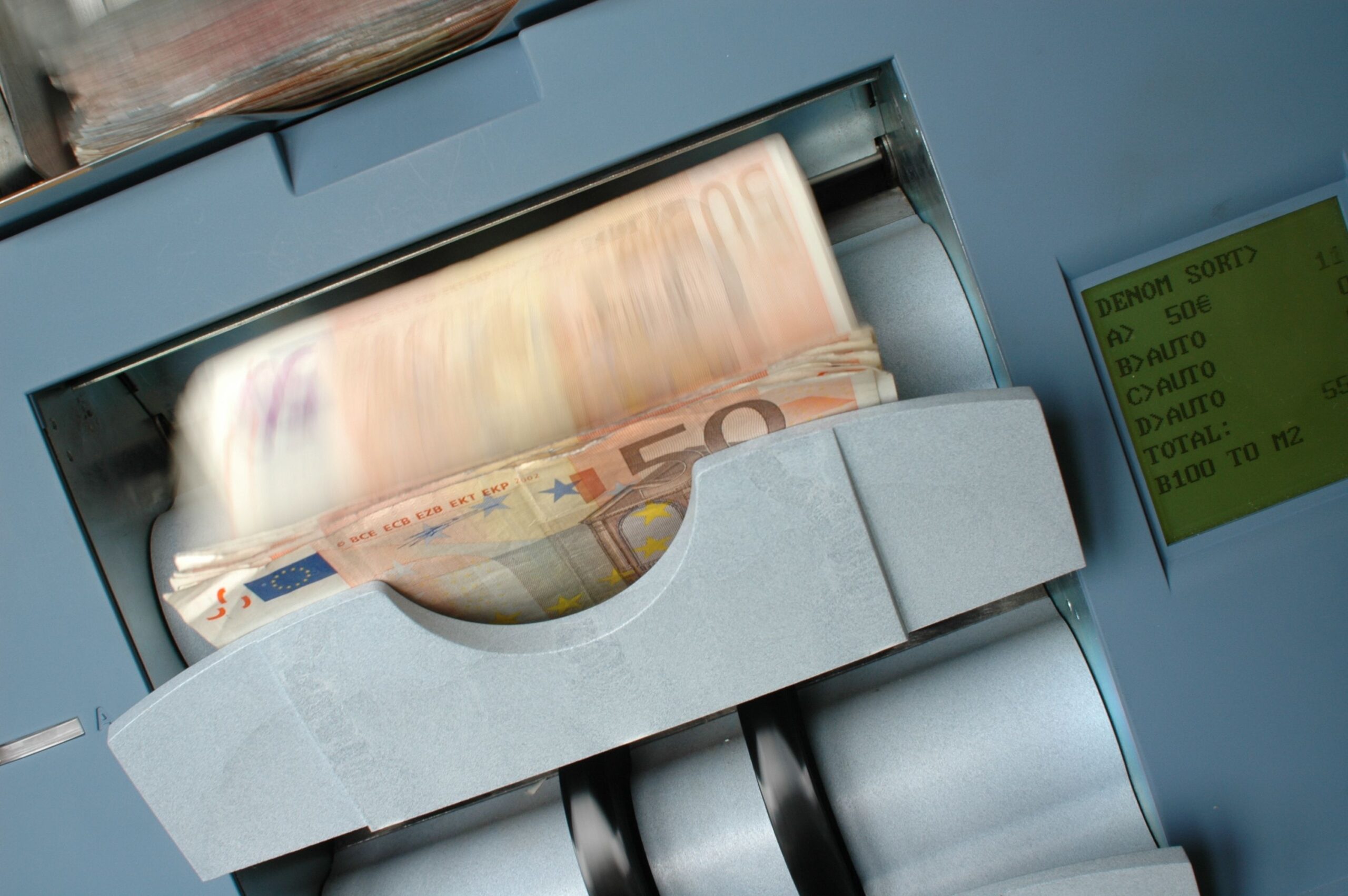 Banknote counting machine representing automated financial processes