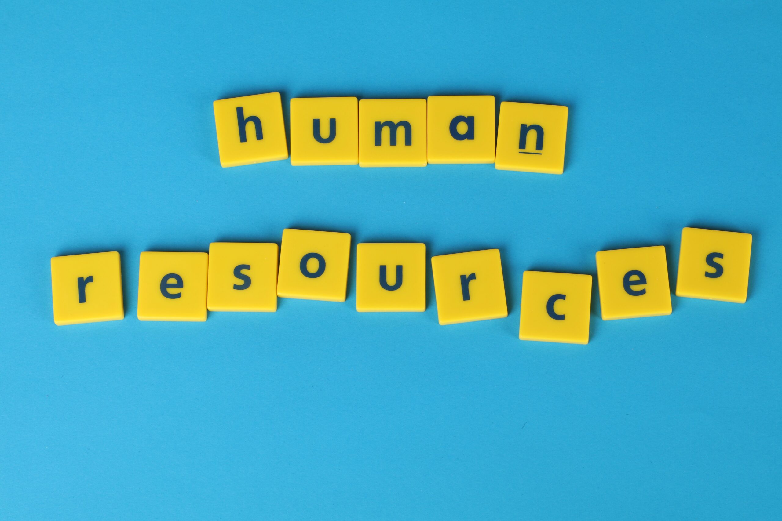 Tiles spelling 'human resources', representing HR process automation